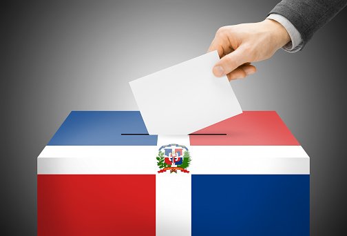 Voting concept - Ballot box painted into national flag colors - Dominican Republic