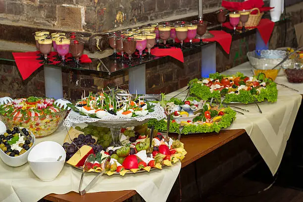 Sumptuous buffet with various cold dishes, salads and desserts. Served on plates and Etageres.