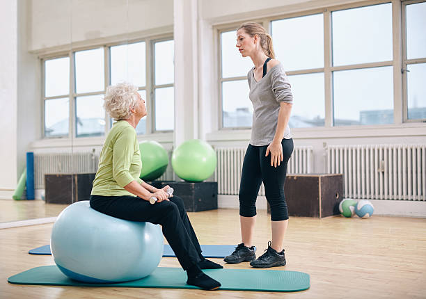 istock Physical therapist instructing a senior woman at rehab 526354893