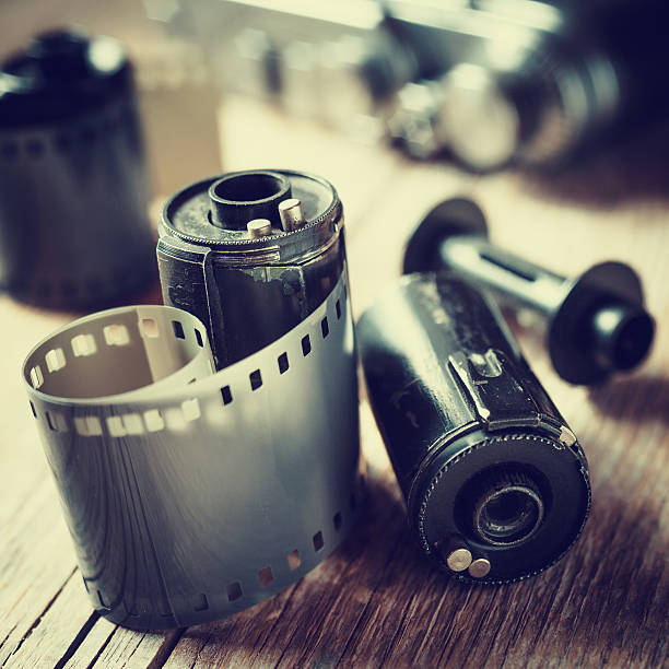istock Old photo film rolls, cassette and retro camera. 526356201