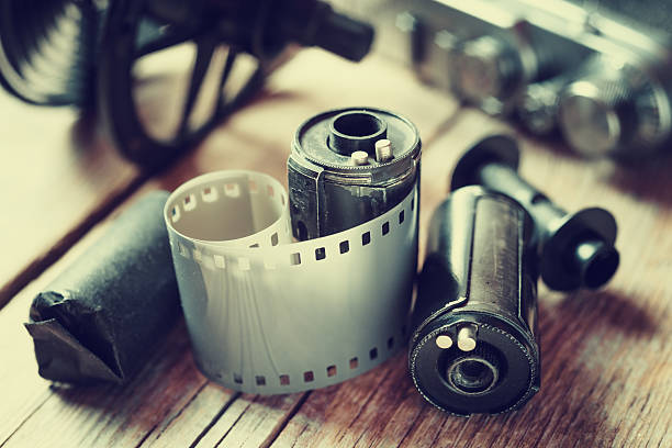 istock Old photo film rolls, cassette and retro camera. 526356205