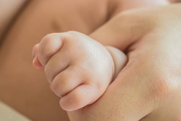istock baby fist 526356547