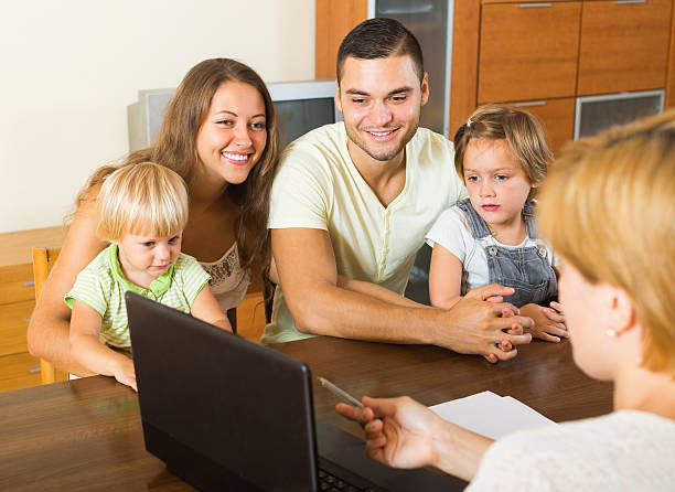 istock Family with insurance agent 526357349