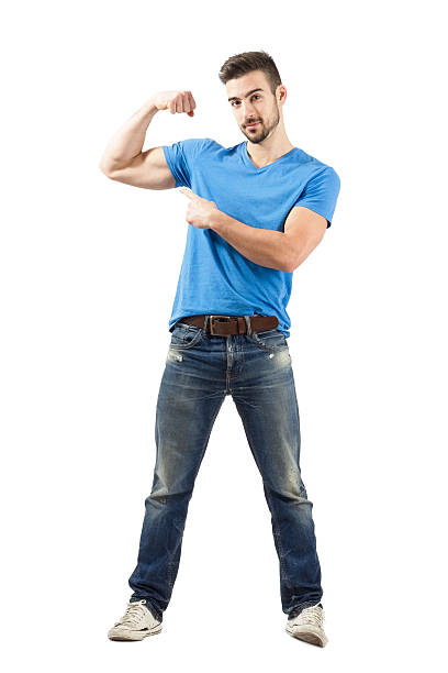 istock Young healthy fit athlete showing bicep muscle 526370325
