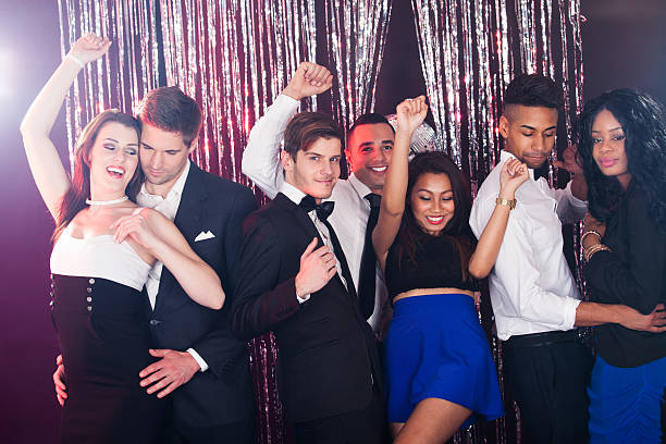 istock Friends Dancing At Nightclub 526372549