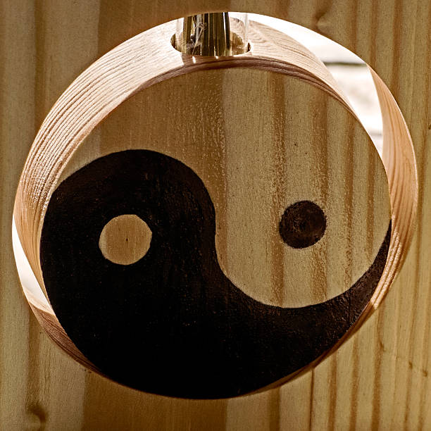 istock Yin and Yang on a wooden stand 526372839