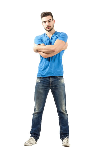 istock Young man with arms wrapped around himself looking at camera 526373259