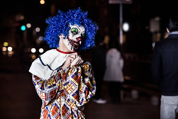 istock Crazy ugly grunge evil clown in town on Halloween 526373497