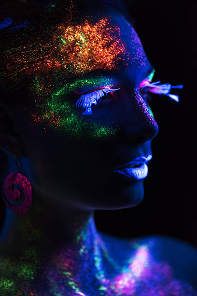 istock Sensual woman in fluorescent paint makeup 526373959
