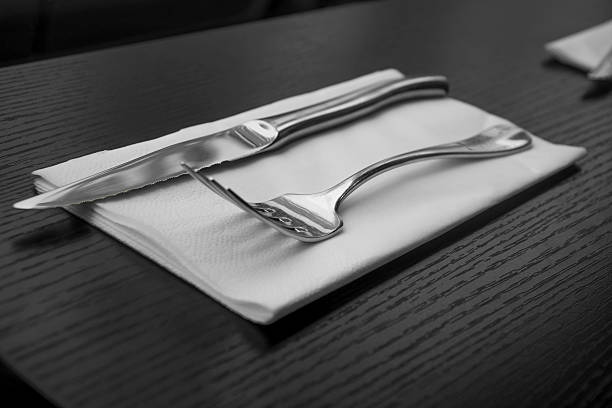 istock Cutlery knife and fork on napkin. 526374029
