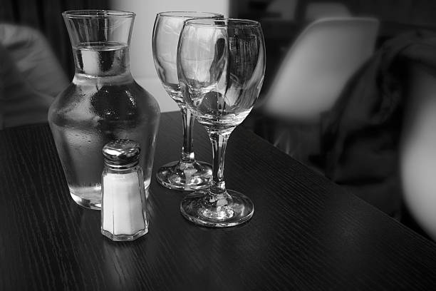 Carafe of water and two glasses.  Indoor shot using natural light.