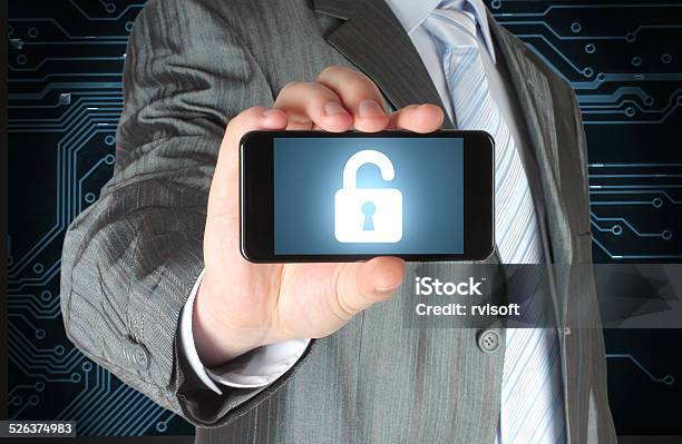 Businessman Holds Smart Phone With Open Lock Stock Photo - Download Image Now - Abstract, Accessibility, Adult