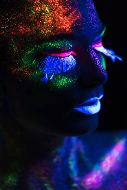 istock Sensual woman in fluorescent paint makeup. Close up 526375143
