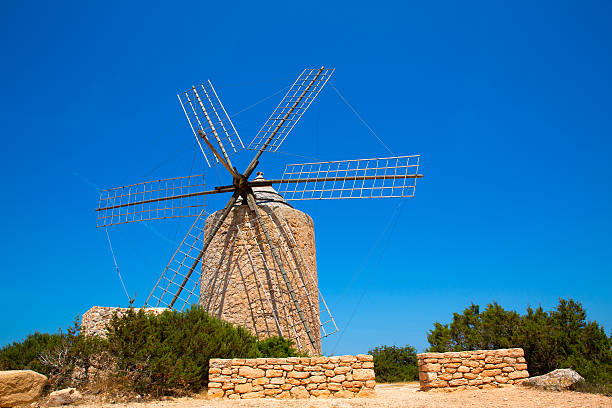 istock Formentera Windmill wind mill vintage masonry and wood 526375705