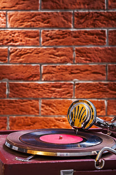 istock Close up view on gramophone on background of the brickwall 526387681