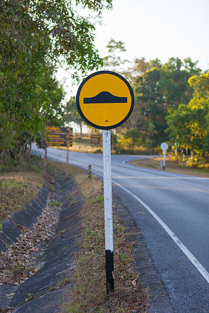 istock Speed bump traffic sign in a park 526388415
