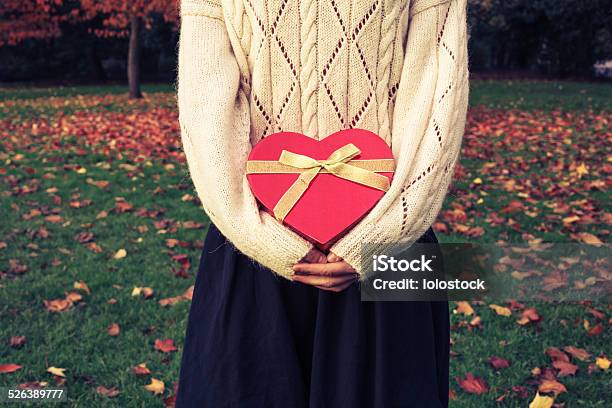 Woman With Heart Shaped Box In Park Stock Photo - Download Image Now - Adult, Autumn, Birthday