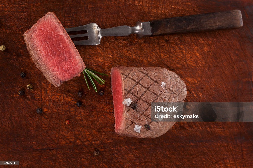 Filet mignon, sirloin steak. Luxurious big beefsteak on wooden background, top view. Culinary steak eating. Filet mignon, sirloin steak. Above Stock Photo