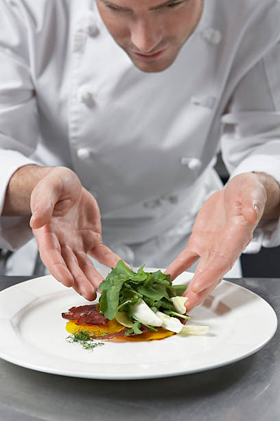 istock Male Chef Preparing Salad In Kitchen 526391601