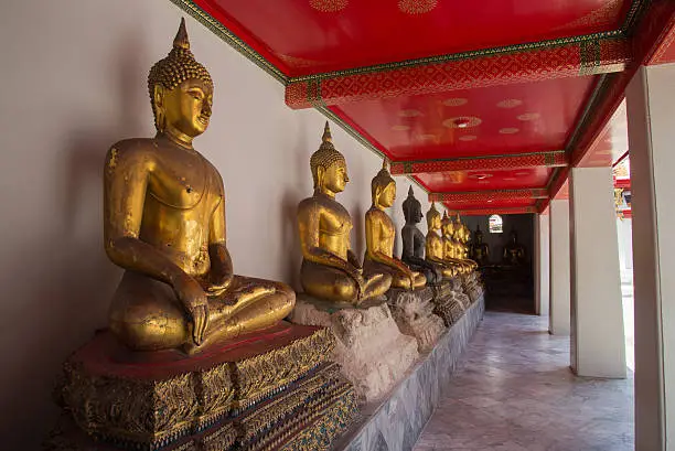 Photo of Row of Buddhas at temple in Bangkok