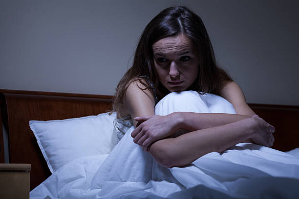 istock Worried woman in bed 526393151