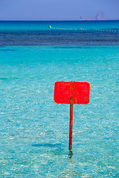 istock turquoise Ibiza Formentera with red sign copyspace 526393215