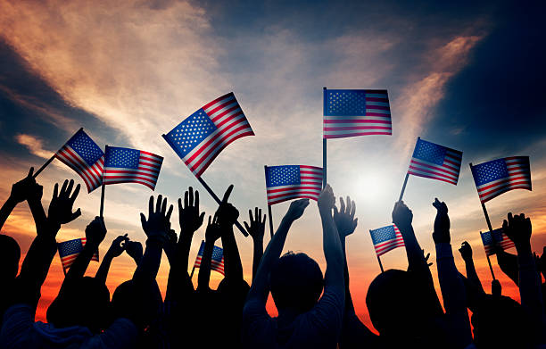 istock Crowd Holding The American Flag 526395417