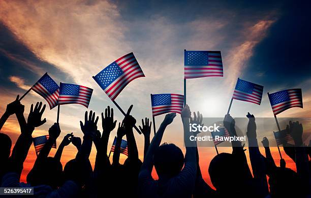 Crowd Holding The American Flag Stock Photo - Download Image Now - American Flag, Crowd of People, Holding