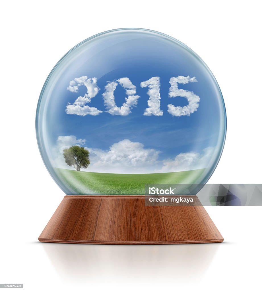 New Year 2015 - Field in Snow Globe Lonely tree and green field landscape with clouds in the shape of "2015" composition in the snow globe. Isolated on white background. 2015 Stock Photo