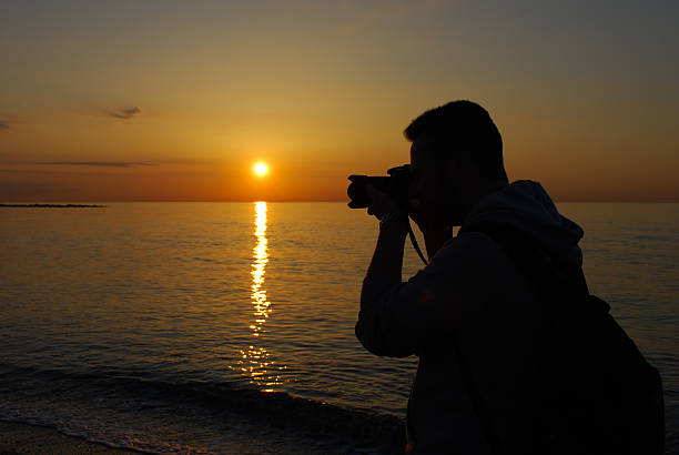 istock Man photographing the horizon 526421947