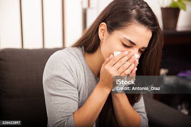 Cute Girl Blowing Her Nose Stock Photo - Download Image Now - 20-29 Years, Adult, Allergy