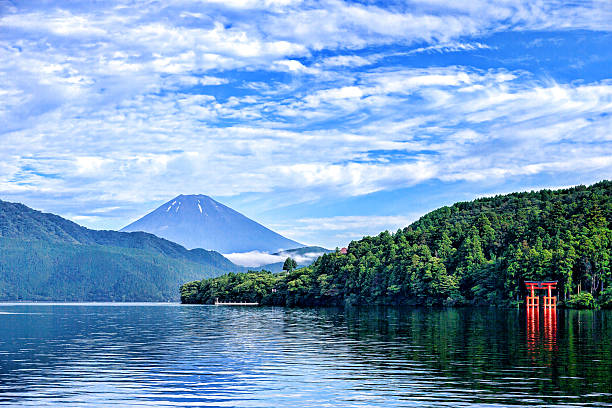 Ashinoko Lake is a scenic lake in the Hakone area of Kanagawa Prefecture in Japan. It is a crater lake that lies along the southwest wall of the caldera of Mount Hakone, a complex volcano. The lake is known for its views of Mt. Fuji and its numerous hot springs. A number of pleasure boats and ferries traverse the lake, providing scenic views for tourists and passengers. Several of the boats are inspired by the design of sailing warships.Beautiful Mt. Fuji in Japan was officially registered as a UNESCO world heritage site on June 26, 2013.
