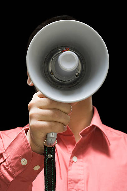 istock Businessman holding megaphone in front of his face 526427453