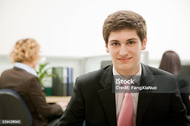 Man Smiling In Office Stock Photo - Download Image Now - 18-19 Years, 20-24 Years, Adult