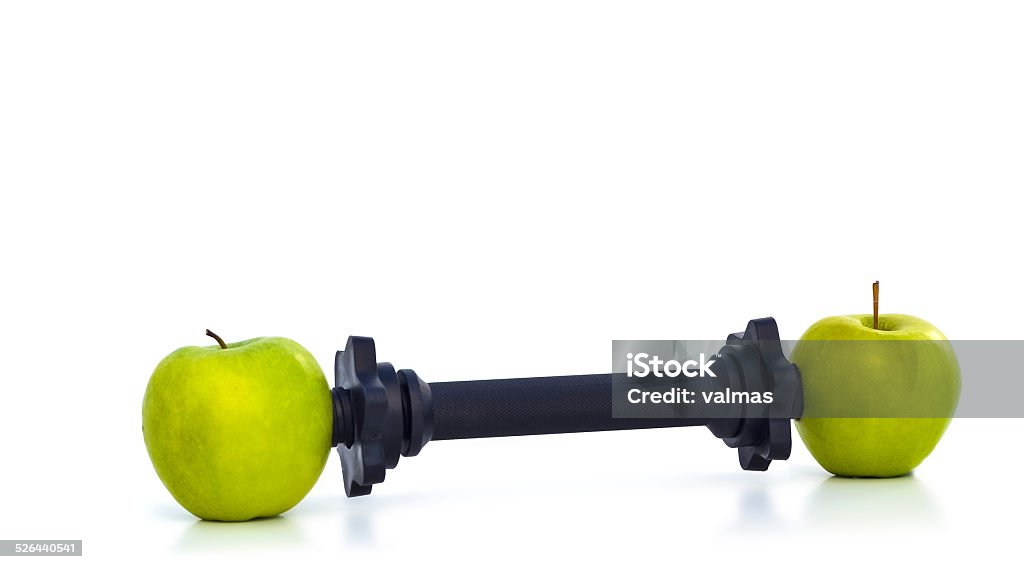 HEALTHY WEIGHT LIFTING An allegory for consuming apples to get in good shape. Activity Stock Photo