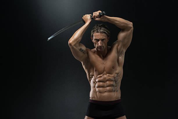 istock Mature Man Holding Sword Ready To Fight 526440923