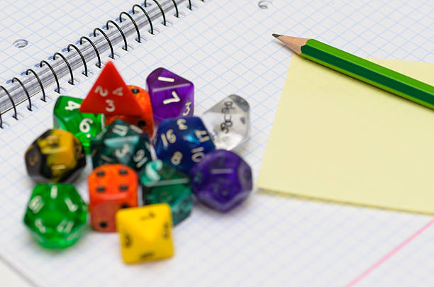 istock open exercise book with set of rpg dices 526442329
