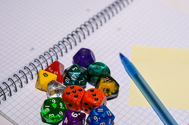 istock open exercise book with set of rpg dices 526442335