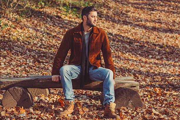 istock Handsome young man posing in the park 526443987