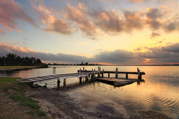 istock Sunset at Squids Ink Jetty, Belmont on Lake Macquarie. 526444151