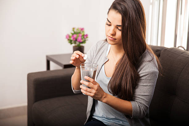 istock Woman taking antacid 526444615