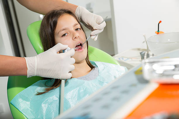 istock Little girl in dentist office 526444721