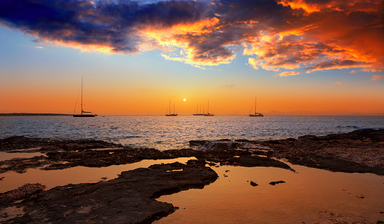 colorful sunset of Ibiza view from formentera with Es Vedra