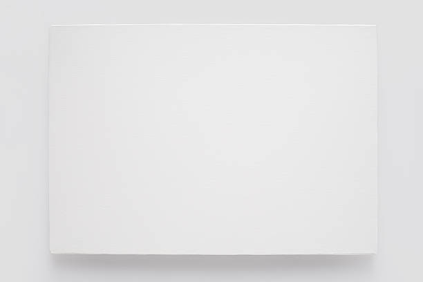 toile blanche sur une civière sur blanc mur - toile à peindre photos et images de collection