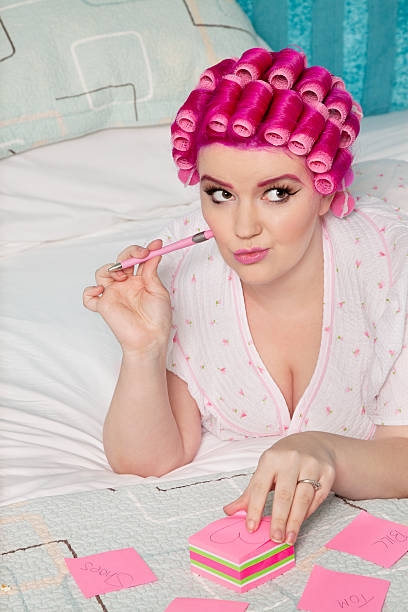 istock Plus size woman in curlers 526445947