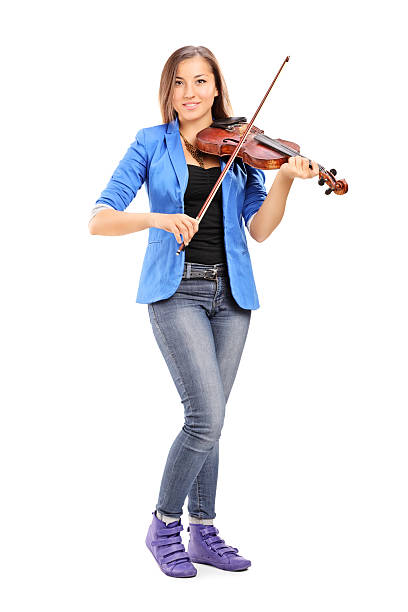 istock Young female artist playing a violin 526447449