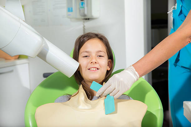 istock Little girl in dentist office 526465439