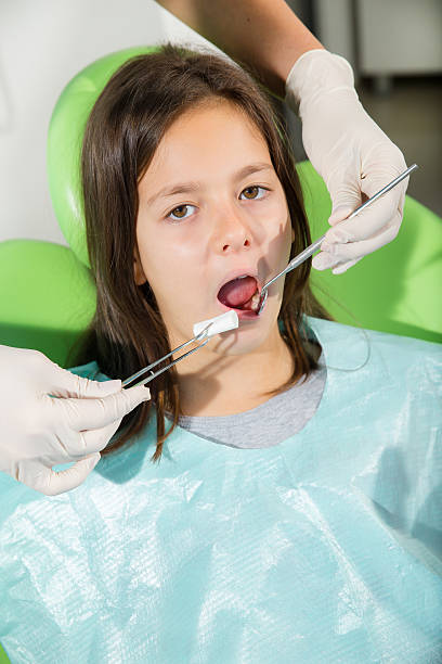 istock Little girl in dentist office 526465469