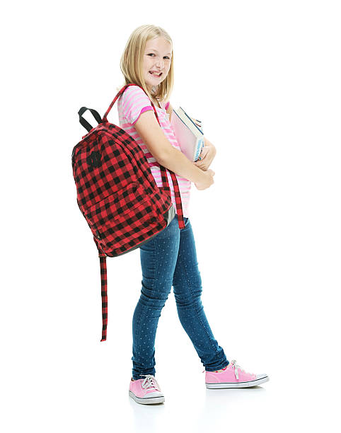 istock Cheerful little student holding books 526468091