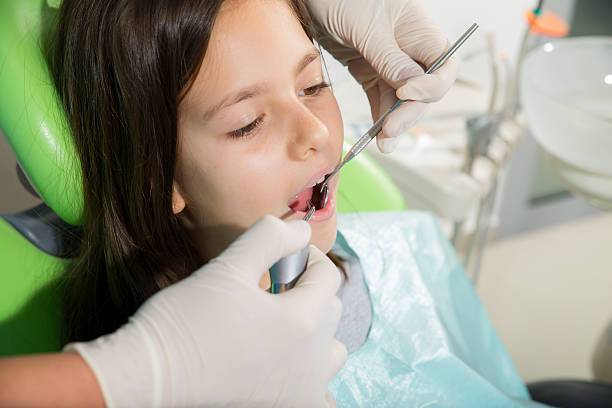 istock Little girl in dentist office 526470191